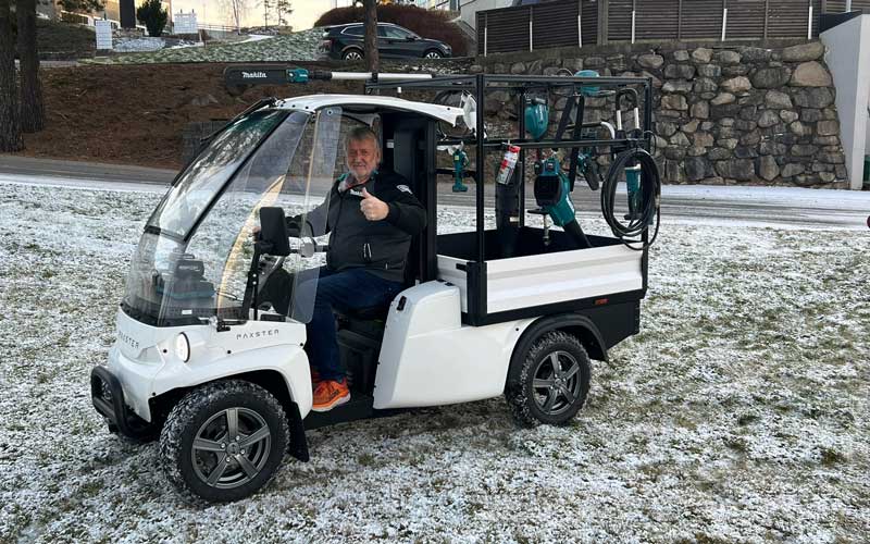 Helge Granly of Bentzen AS behind the wheel of a Paxster Stretch – delivering sustainable mobility to the cemetery and park sector.